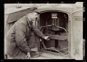 [Railroad worker at track switch]