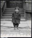[Child at curb]