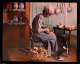 [Genre scene, woman in kitchen peeling vegetables]