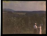 [Man and woman looking over landscape]