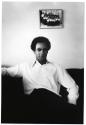 Huey and photo on wall, Oakland CA