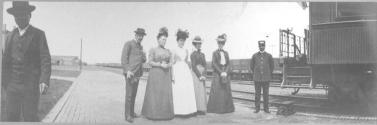 Travel companions beside train, California Trip