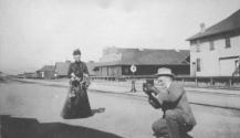 George Eastman photographing Maria Eastman holding fruit, California Trip