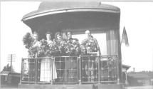 George Eastman and companions on back of train car, California Trip