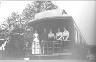 George Eastman's companions on back of train, California Trip