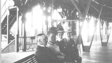 George Eastman and companions inside train station, California Trip