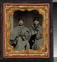 [Two soldiers wearing hats and gloves, holding a canteen and satchel]