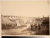 [Civil War soldiers standing by railroad bridge]