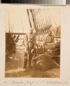 [Gunner Thomas C. Cuddy standing next to cannons, Simon's Bay, South Africa]