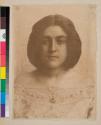 [Woman wearing off-the-shoulder, embroidered clothing]