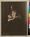 [Woman with guitar]