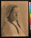 [Girl with braided hair and lace drape]
