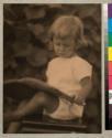 [Child reading book]