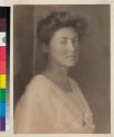 [Woman wearing embroidered clothing]