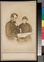 [Facsimile carte-de-visite, Abraham Lincoln reading to his son Tad]