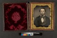 [Man with bowtie and earrings]