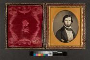 [Man with beard and patterned vest]