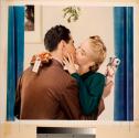 [Couple kissing under mistletoe]