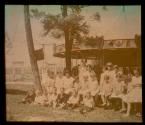 [Children in front of carousel]