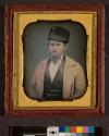 [Portrait of man wearing light coat and fur hat]