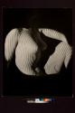 [Projection on nude torso]