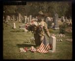 [Soldier at gravesite]