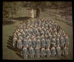 [Catholic School girls by statue of the Blessed Mother]