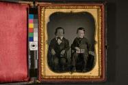 [Two boys, one holding daguerreotype]