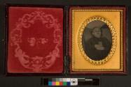 [Postmortem of girl holding photograph]