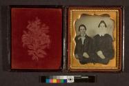 [Dr. Benton and wife (Dr. Benton is holding a cannula, or bleeding tool)]