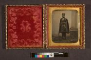[Man with hand-guns and rifle (possibly soldier)]