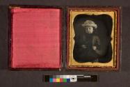 [Girl in hat and coat]