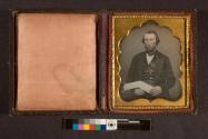 [Man with folded paper]