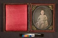 [Portrait of girl holding small basket]