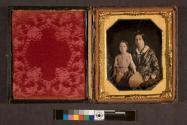 [Portrait of woman and child, woman holding fan]