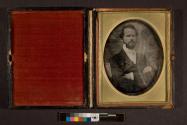 [portrait of man with arms folded]