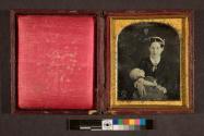 [Woman holding baby (possibly postmortem)]