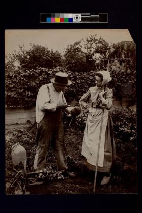 [Man and woman working in garden]