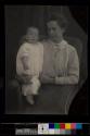 [Woman holding baby]