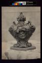 [Sculpture with relief of face]