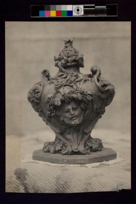 [Sculpture with relief of face]