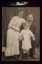 [Man and woman with young child]