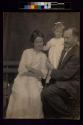 [Man and woman with young girl]