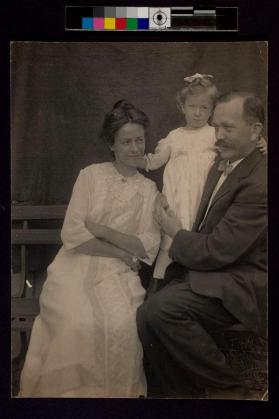 [Man and woman with young girl]