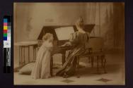 [Woman at piano, child listening]