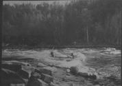 George Eastman running Alexander Rapids, Lake Nipigon Trip
