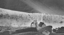 Nell Newhall reading in tent, High Sierras Trip