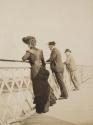 Travel companions viewing water from bridge, Western Trip