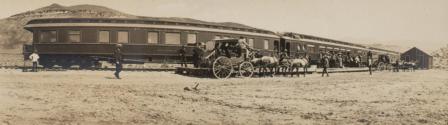 Horse drawn wagons approaching railroad, Western Trip