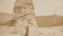 Mary Mulligan posing in front of Yellowstone rock formation, Western Trip